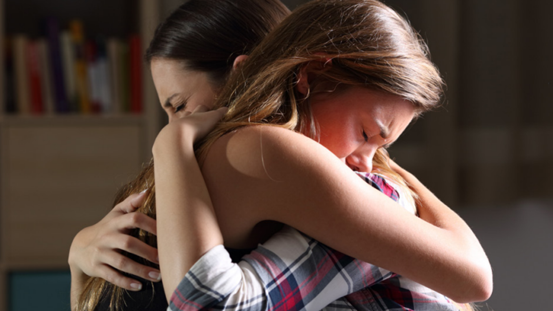 Mother and daughter hugging