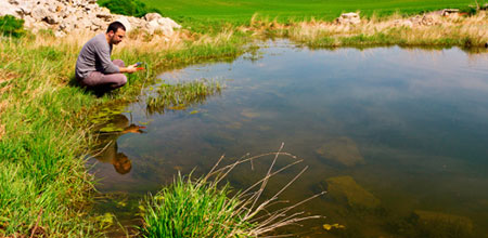 man testing river water for toxins