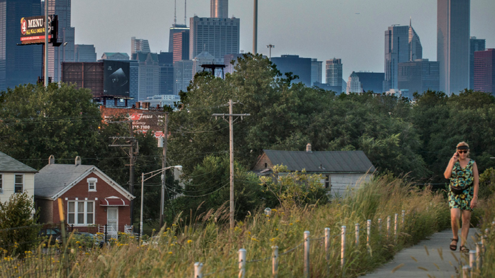 Woman walking on nature trail in city