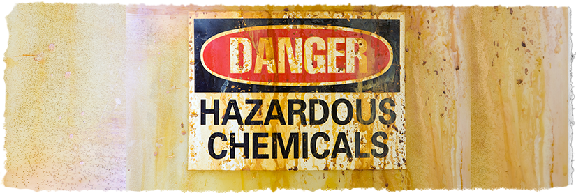 "Danger Hazardous Chemicals" sign with stains and marks