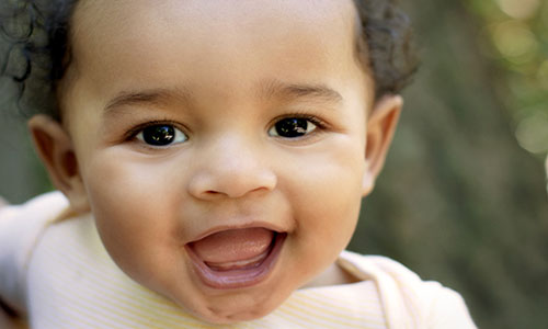 Close up cute African American baby outdoors