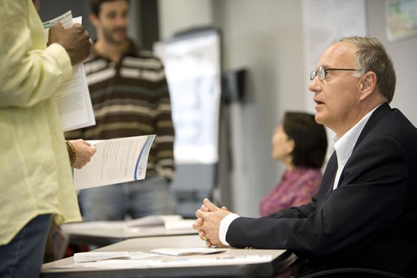 Four people meeting in an office.