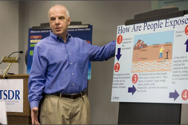 Man standing and teaching about community engagement strategies