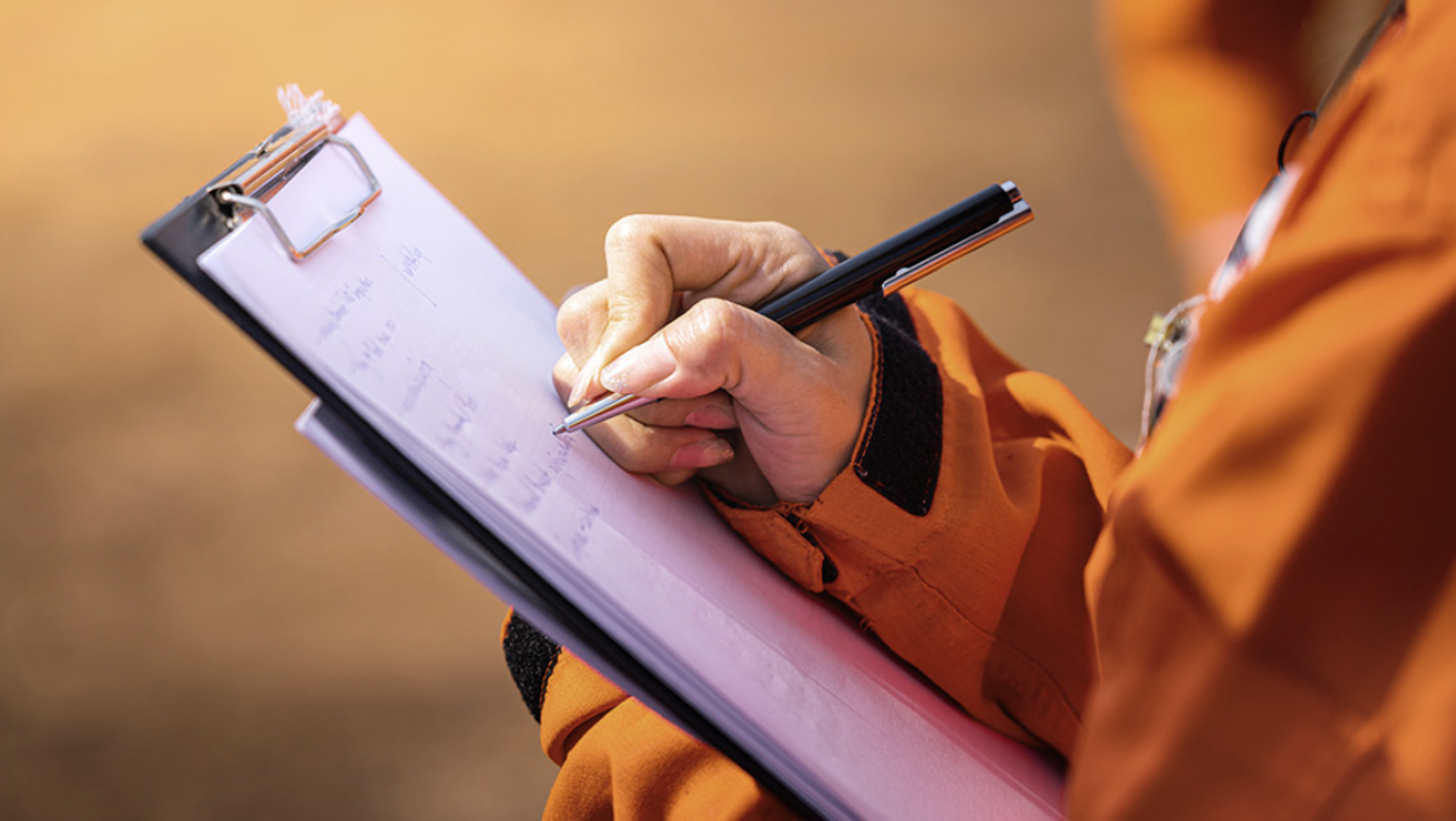 Picture of a man holding a clipboard